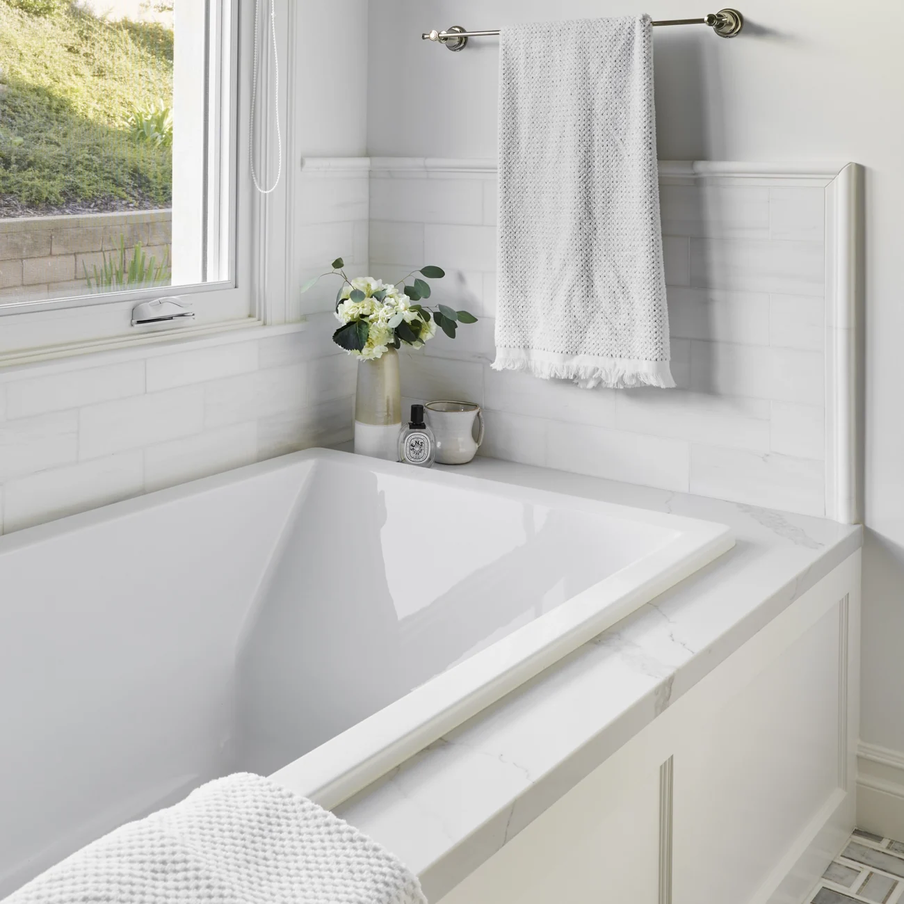 Christine Vroom Interiors Vigilance | bathroom with soaker tub and window