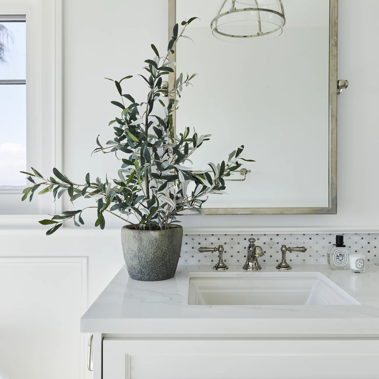 Christine Vroom Interiors Vigilance | Bright white marble bathroom vanity