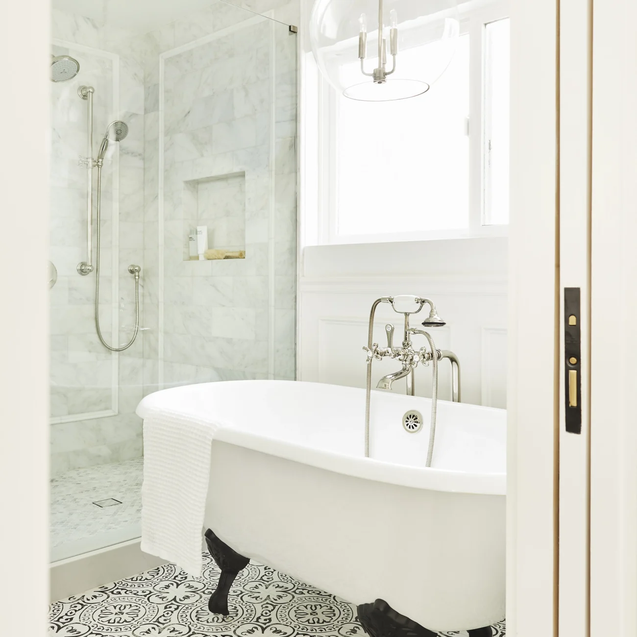 Christine Vroom Interiors | Gentry | Bright, white bathroom with soaker tub