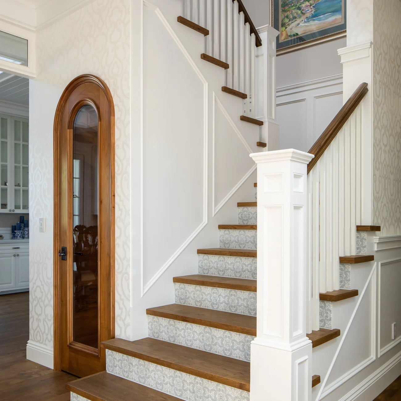 Christine Vroom Interiors Strawberry Lane | Traditional white stairwell and wood treads with accents