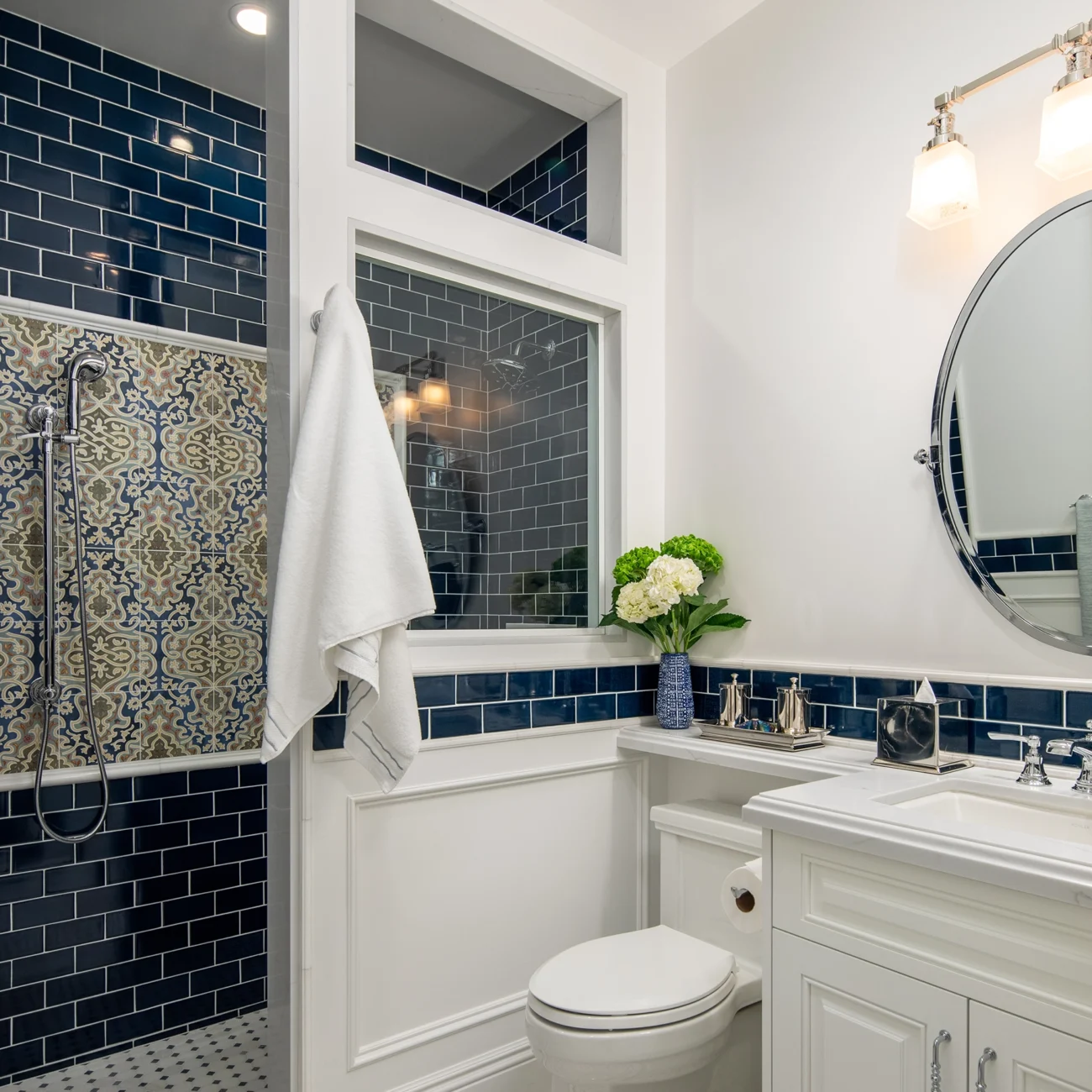 Christine Vroom Interiors Strawberry Lane | Dark blue subway tiles in contemporary bright white bathroom
