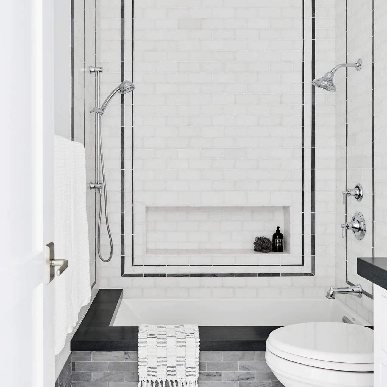 Christine Vroom-Interiors Thayer | Traditional bathroom tiled bathroom with white and black tile