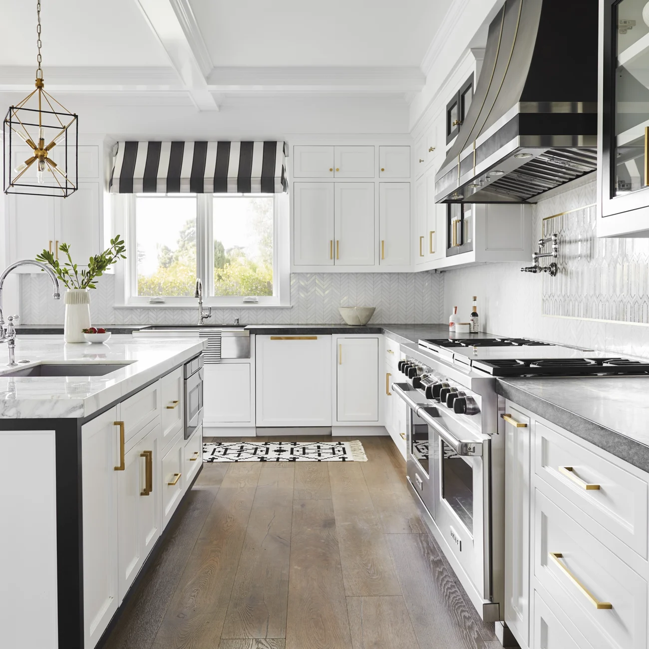 Christine Vroom-Interiors Thayer | Traditional white kitchen with black stove hood, accents