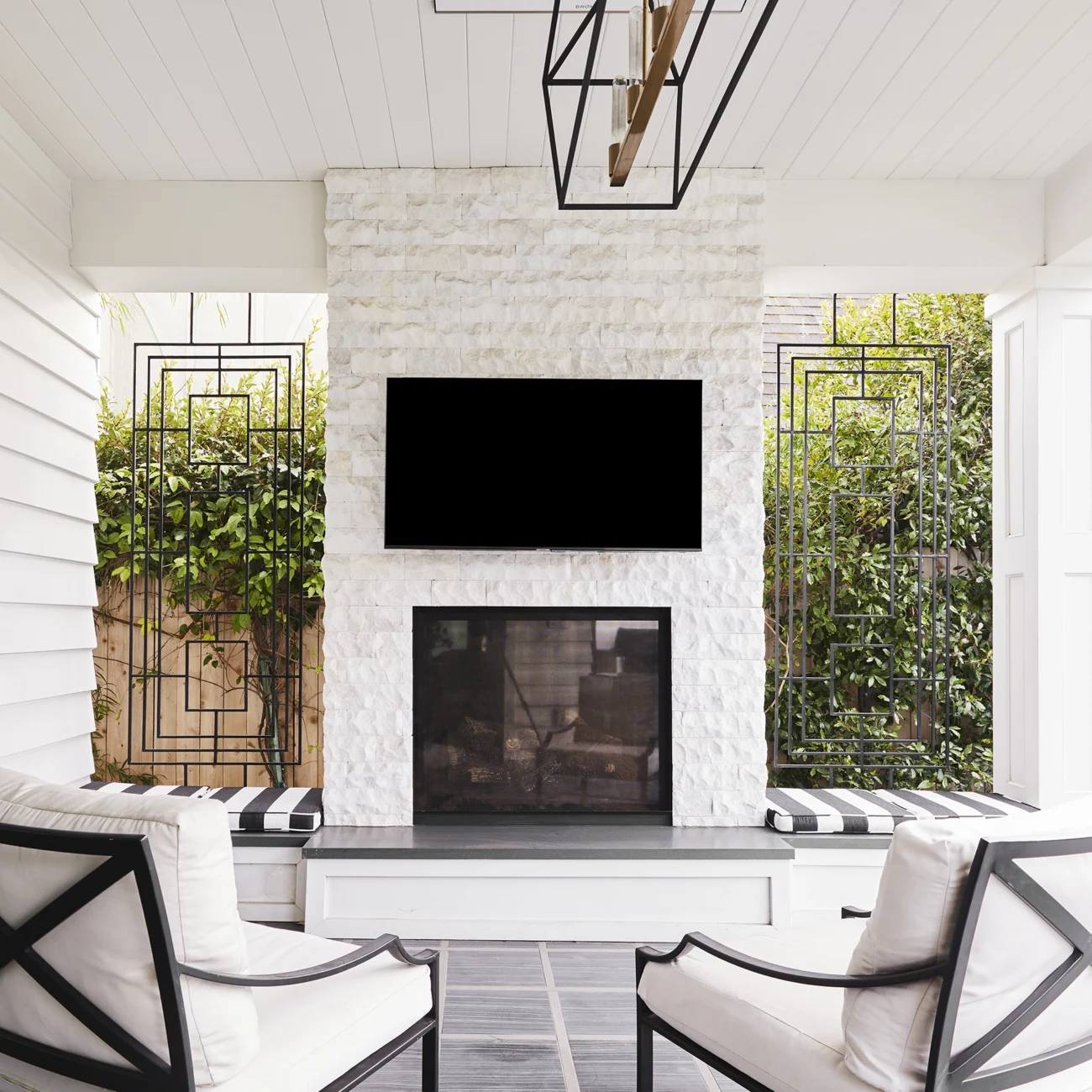 Christine Vroom-Interiors Thayer | Traditional white living room with white stone fireplace