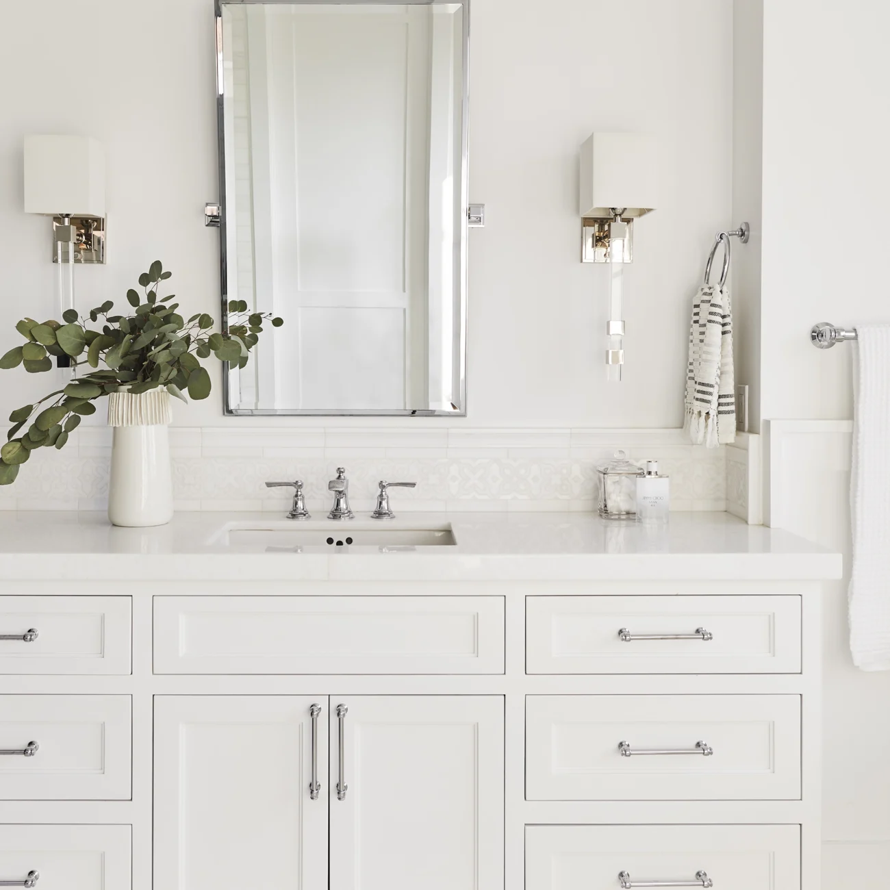 Christine Vroom-Interiors Thayer | Traditional white luxury bathroom with white cabinetry
