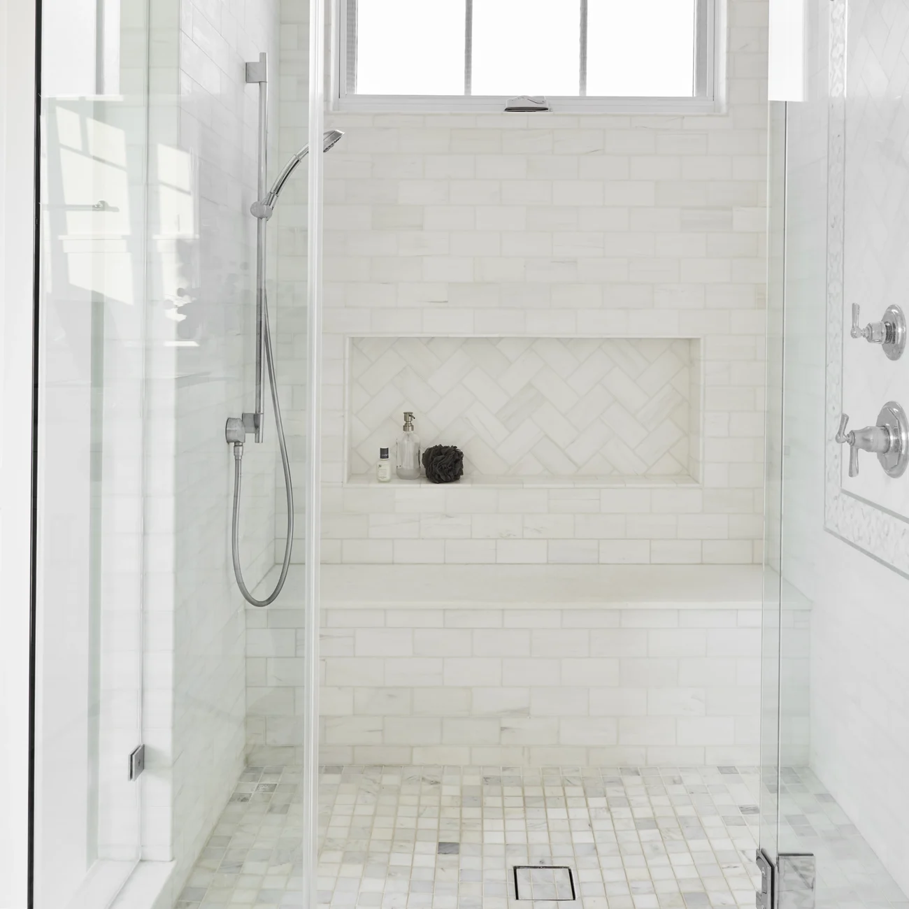 Christine Vroom-Interiors Thayer | Traditional white luxury bathroom with glass shower and marble tile
