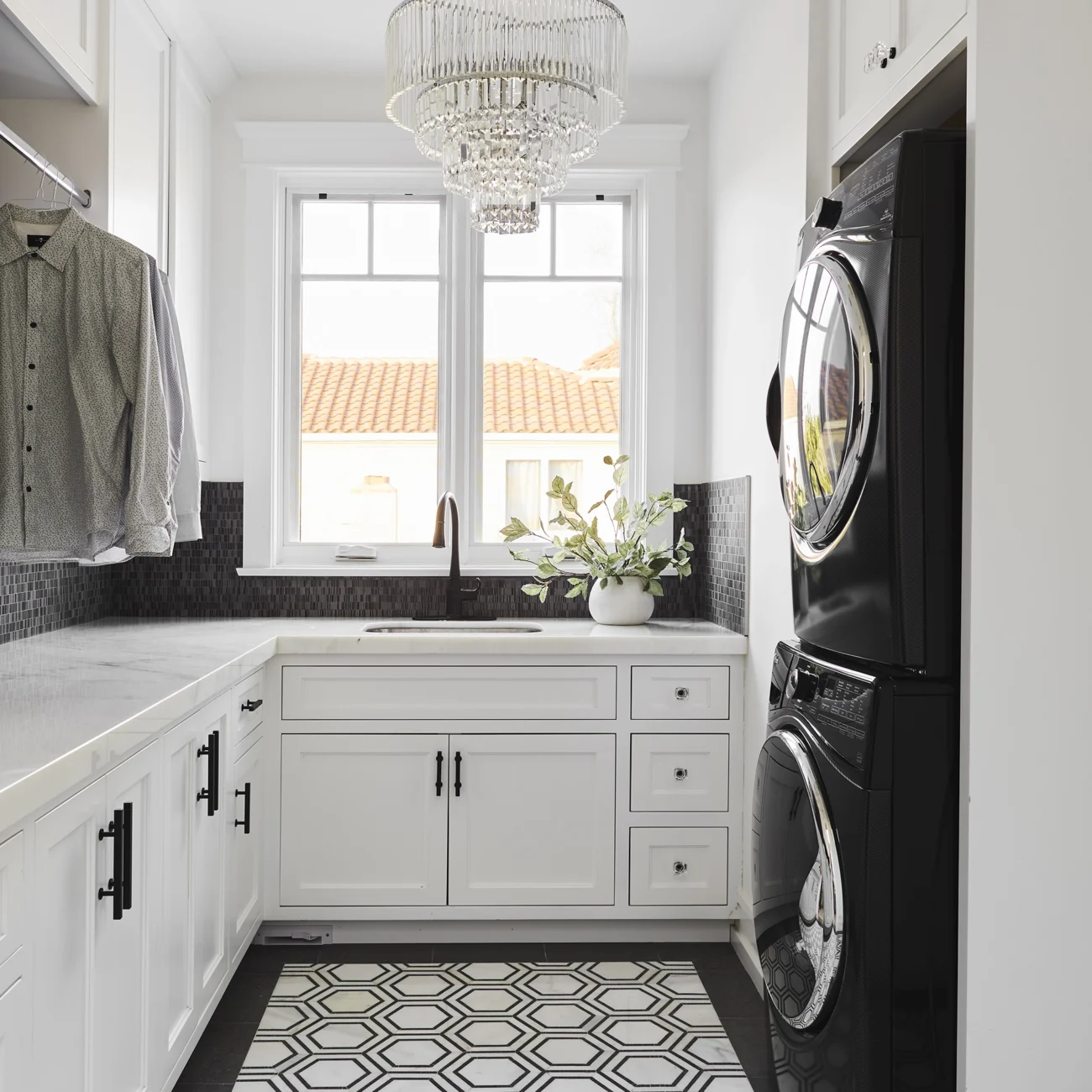 Christine Vroom-Interiors Thayer | Traditional laundry room with black appliance and black and white tile