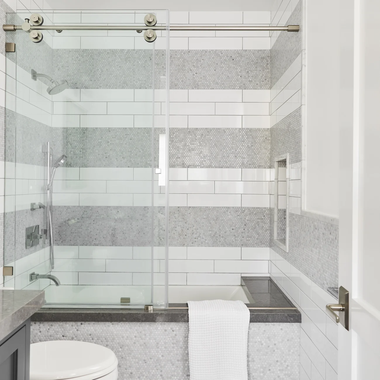 Christine Vroom-Interiors Thayer | Traditional bathroom with grey and white tile in glass shower