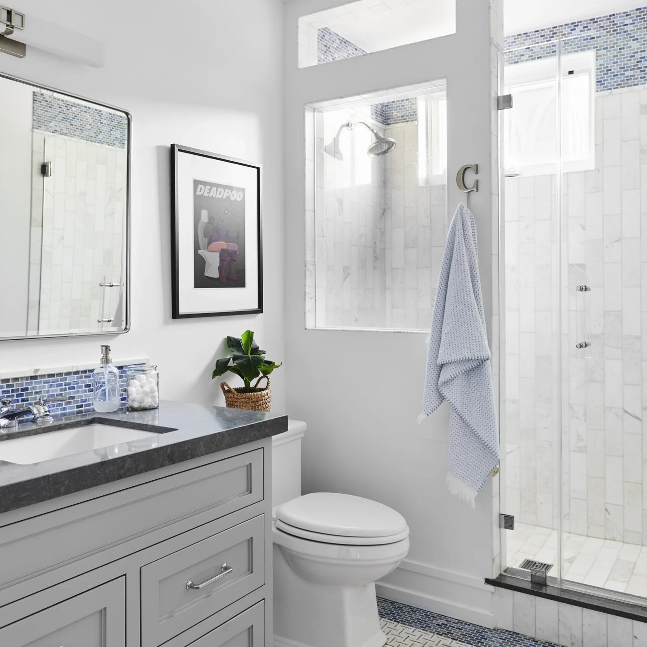 Christine Vroom-Interiors Thayer | Traditional bathroom with grey cabinets and blue and white tile