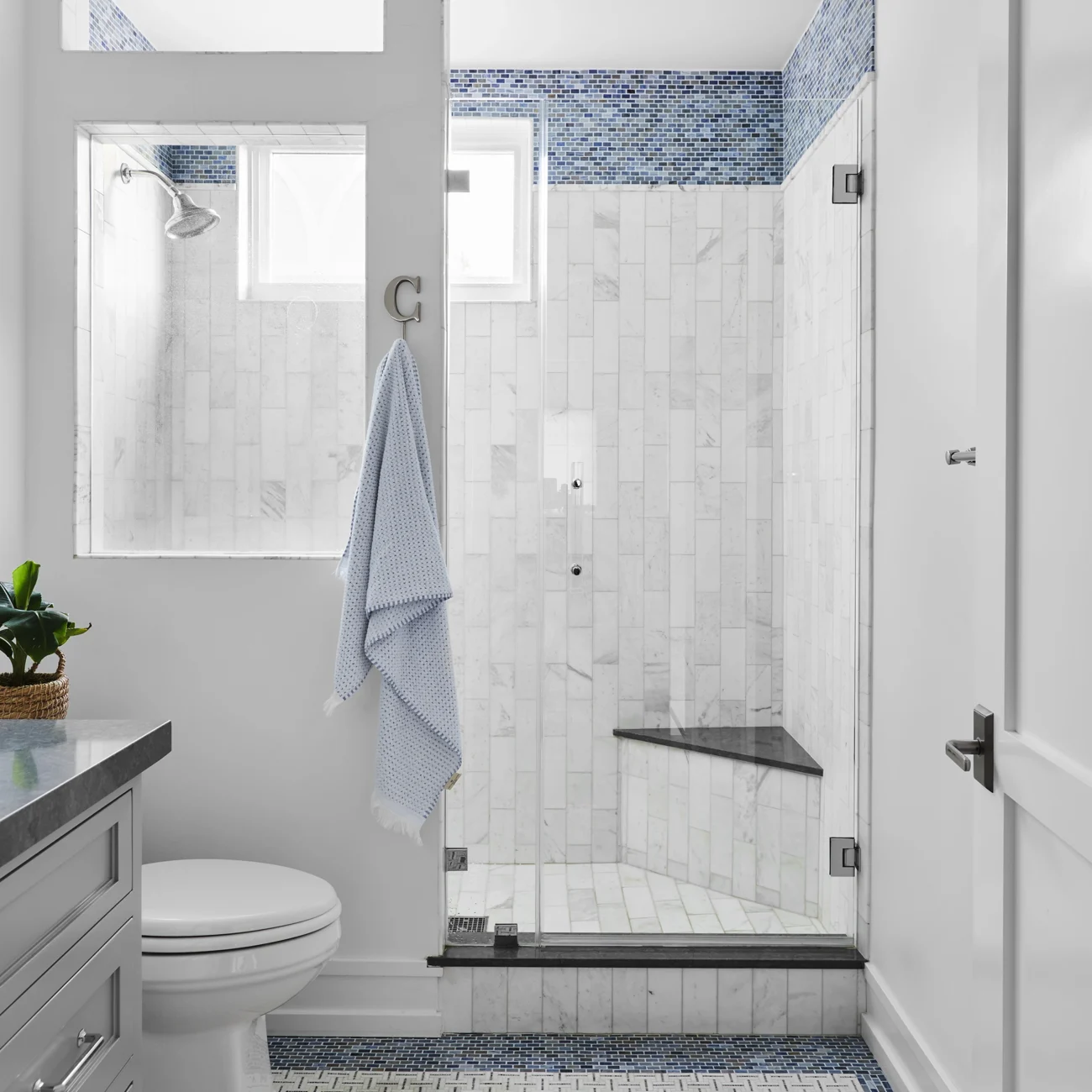 Christine Vroom-Interiors Thayer | Traditional bathroom with grey cabinets and blue and white tile