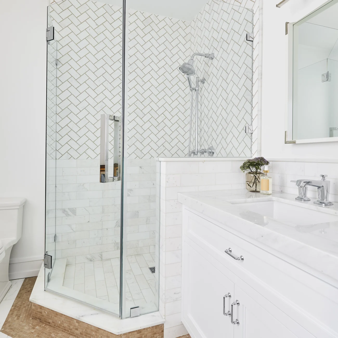 Christine Vroom-Interiors Thayer | Traditional bathroom with glass enclosed shower with Herringbone patterned tile