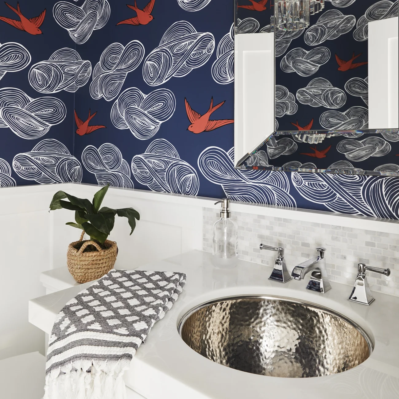 Christine Vroom-Interiors Thayer | Traditional powder room with white fixtures and whimsical navy and red wallpaper and silver undermount sink