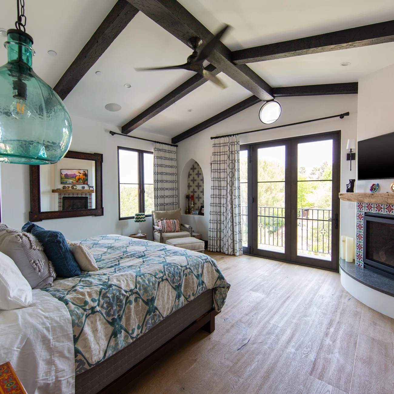 Christine Vroom Interiors | Via Arriba | Master Bedroom with exposed beams, fireplace and french doors