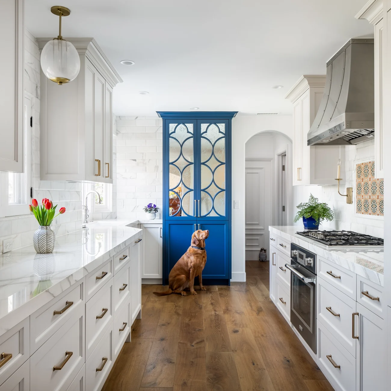 Christine Vroom Interiors | Via-Arriba | Bright white kitchen with bright blue door
