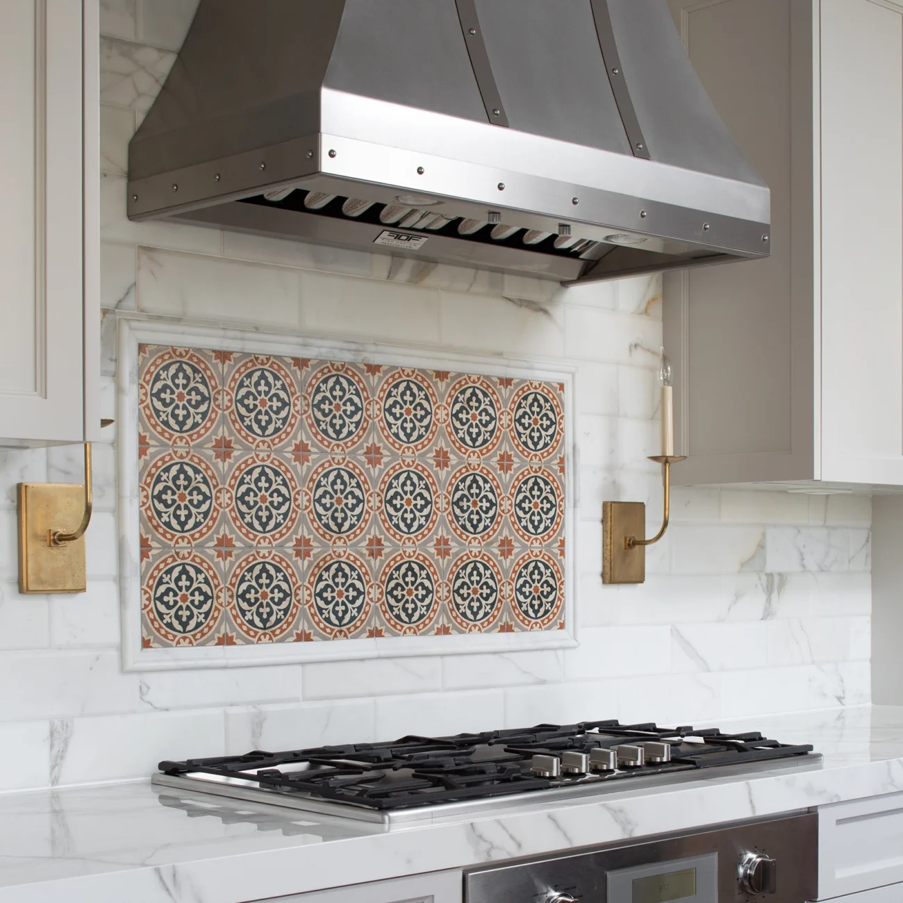 Christine Vroom Interiors | Via Arriba | Kitchen stove with custom range hood and Spanish tile backsplash