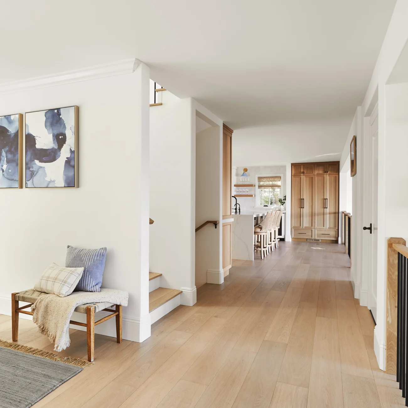 Christine Vroom Interiors | Via Almar | Costal hallway with light hardwood flooring