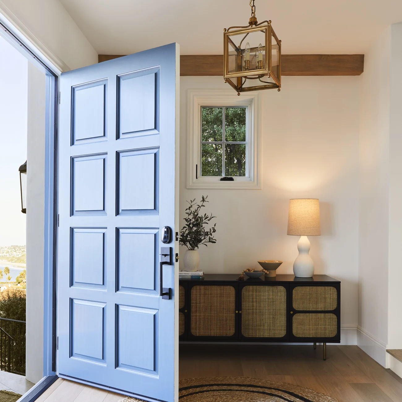 Christine Vroom Interiors | Via Almar | Costal entry way with blue front door