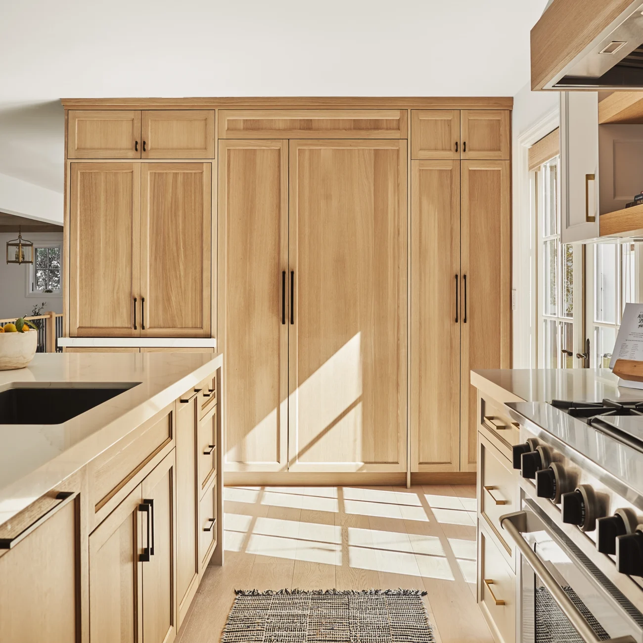 Christine Vroom Interiors | Via Almar | Costal Bright kitchen with cabinte covered applainces