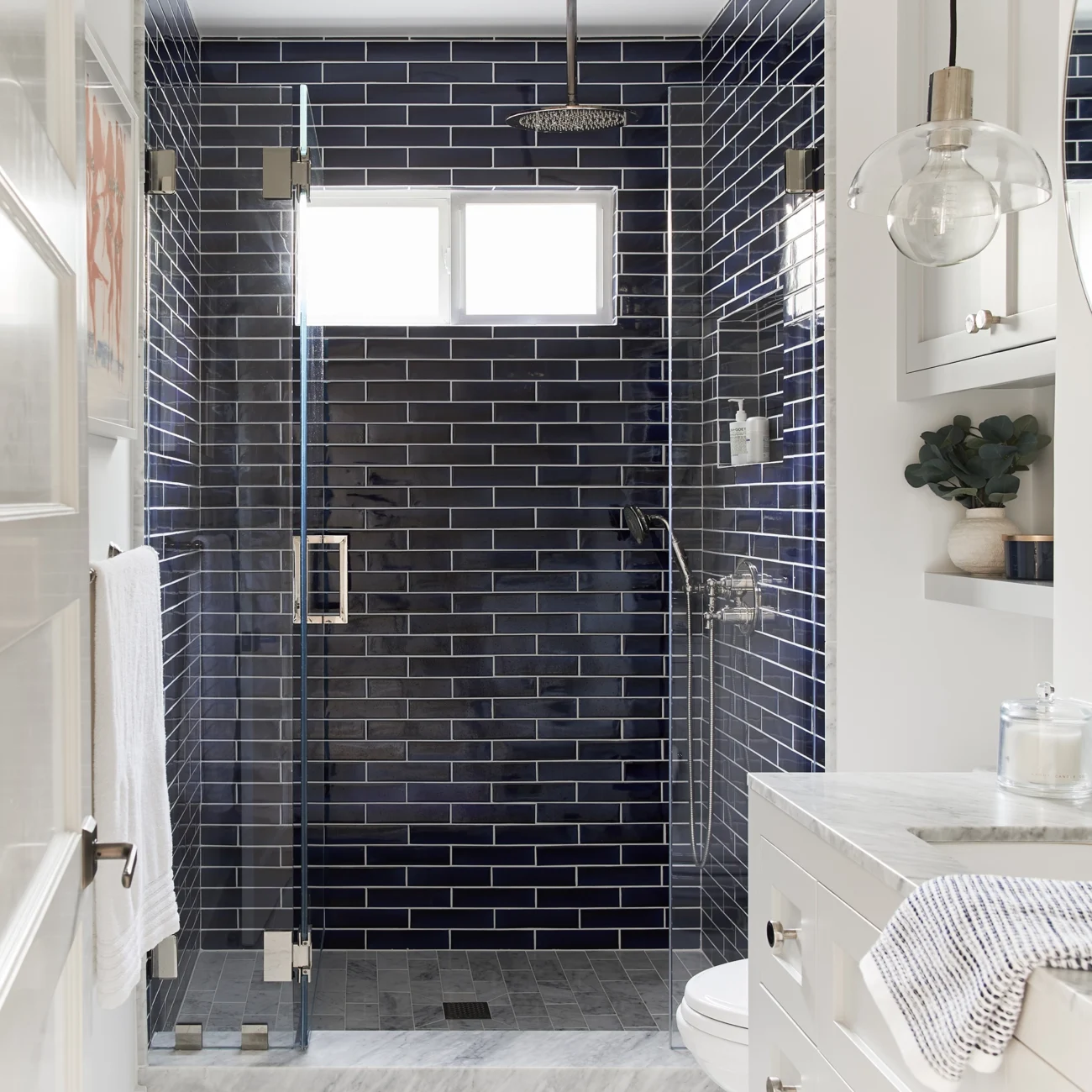 Christine Vroom Interiors | Marco | Modern bathroom with navy blue tile