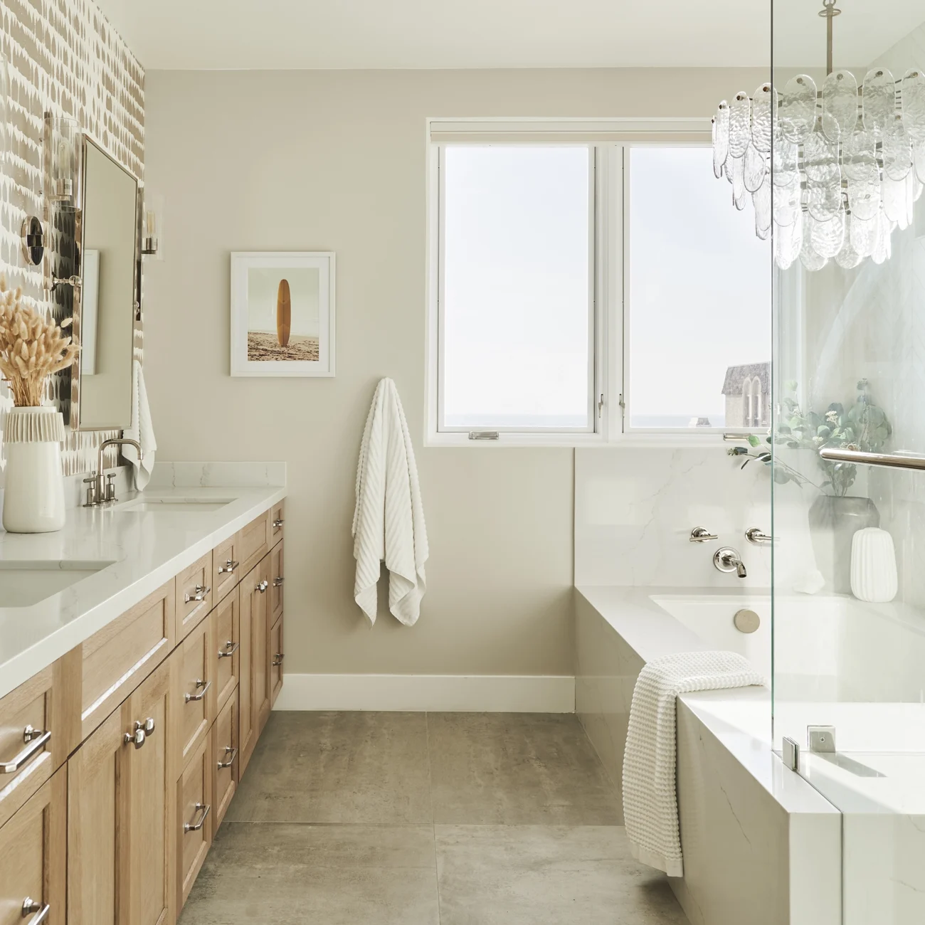 Christine Vroom Interiors | 27th | bright, costal bathroom with chandelier and soaker tub