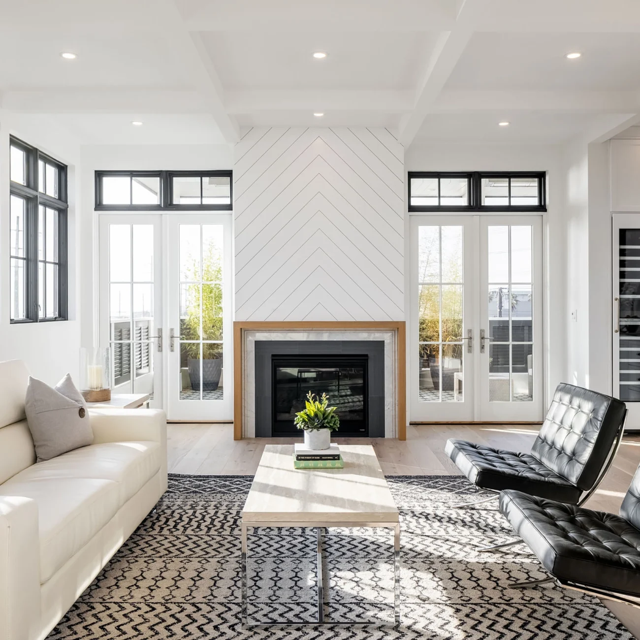 Christine Vroom Interiors | 36th | Costal, bright, white, living room with black accents and fireplace