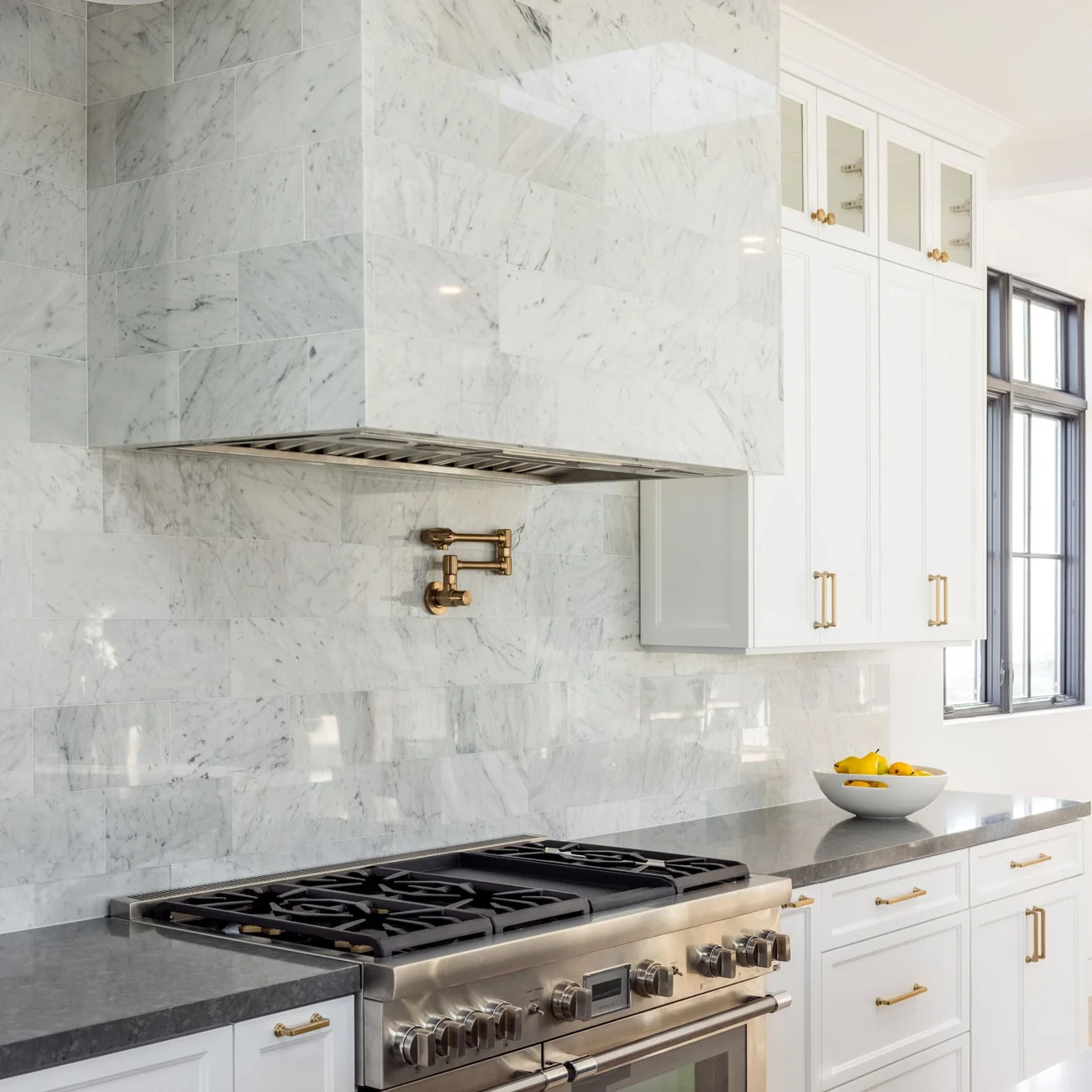 Christine Vroom Interiors | 36th | Costal kitchen stove with tiled hood