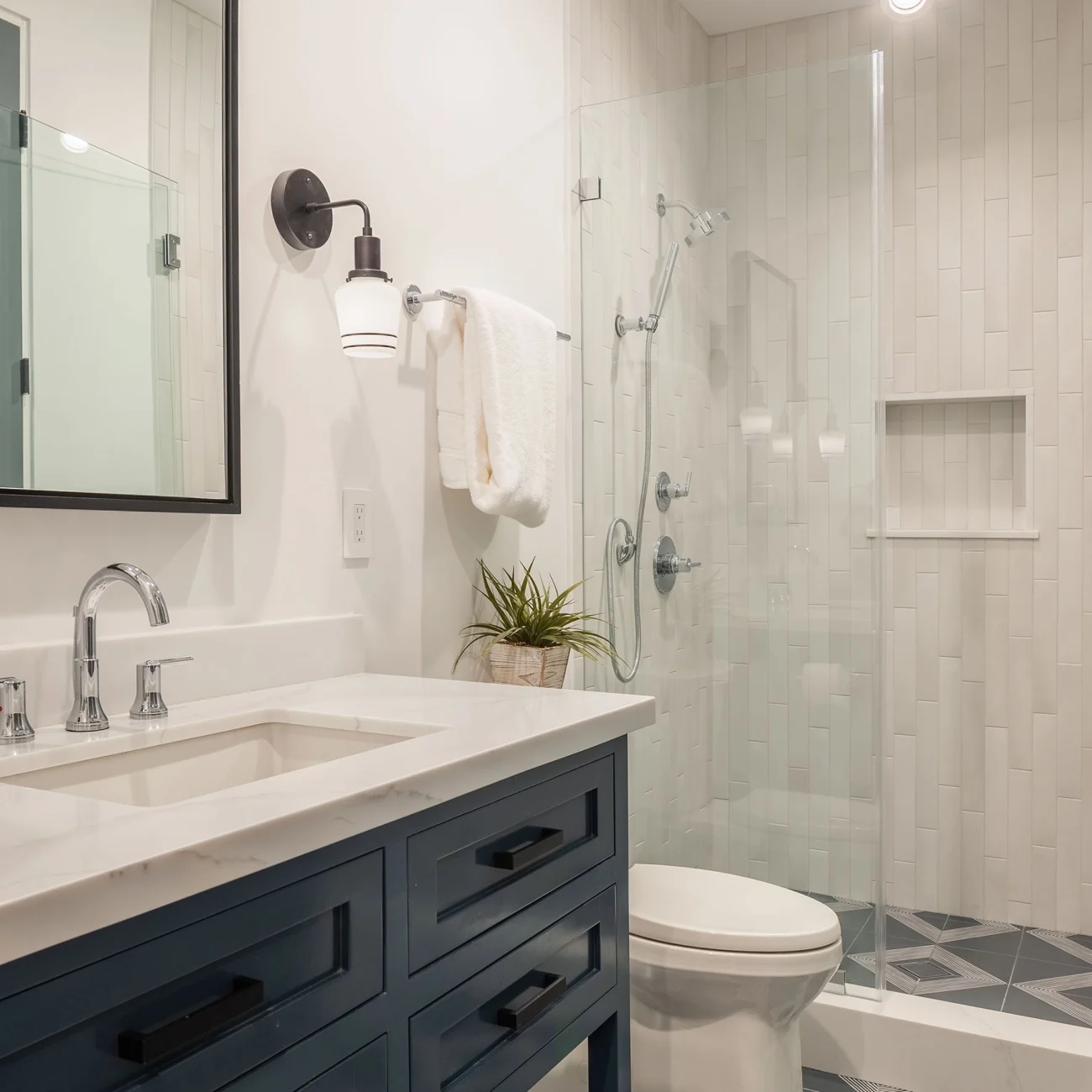 Christine Vroom Interiors | 36th | Costal bathroom with blue/green vanity and glass shower