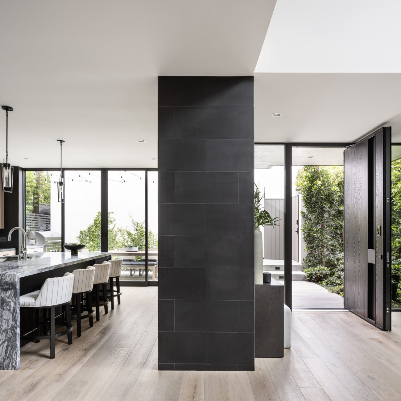Christine Vroom Interiors | Laurel | Modern Kitchen and divider wall from Entry hall